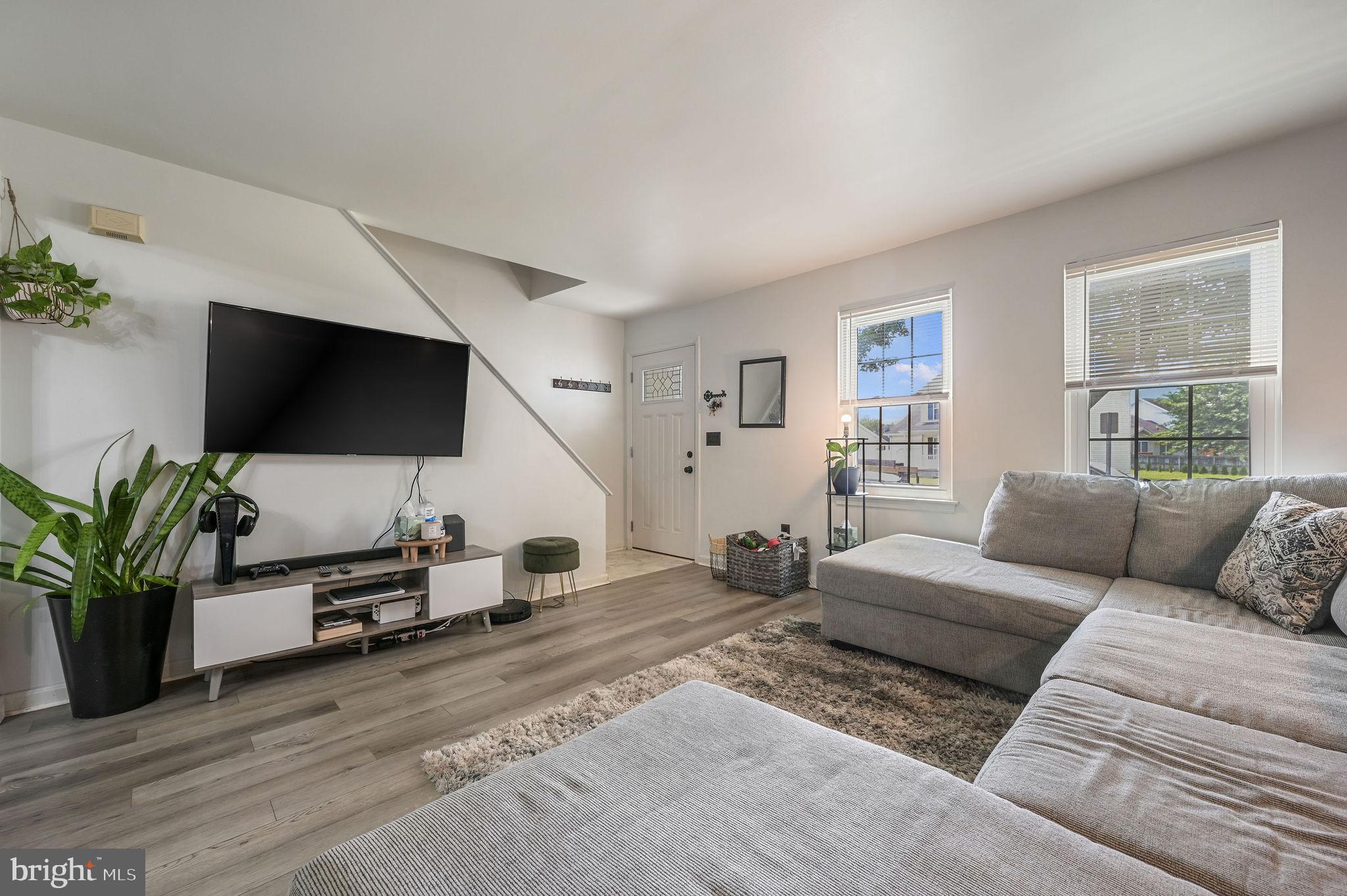 147 Holmes Street Dover, DE 19901 - Photo 3 of 19 a living room with furniture and a flat screen tv