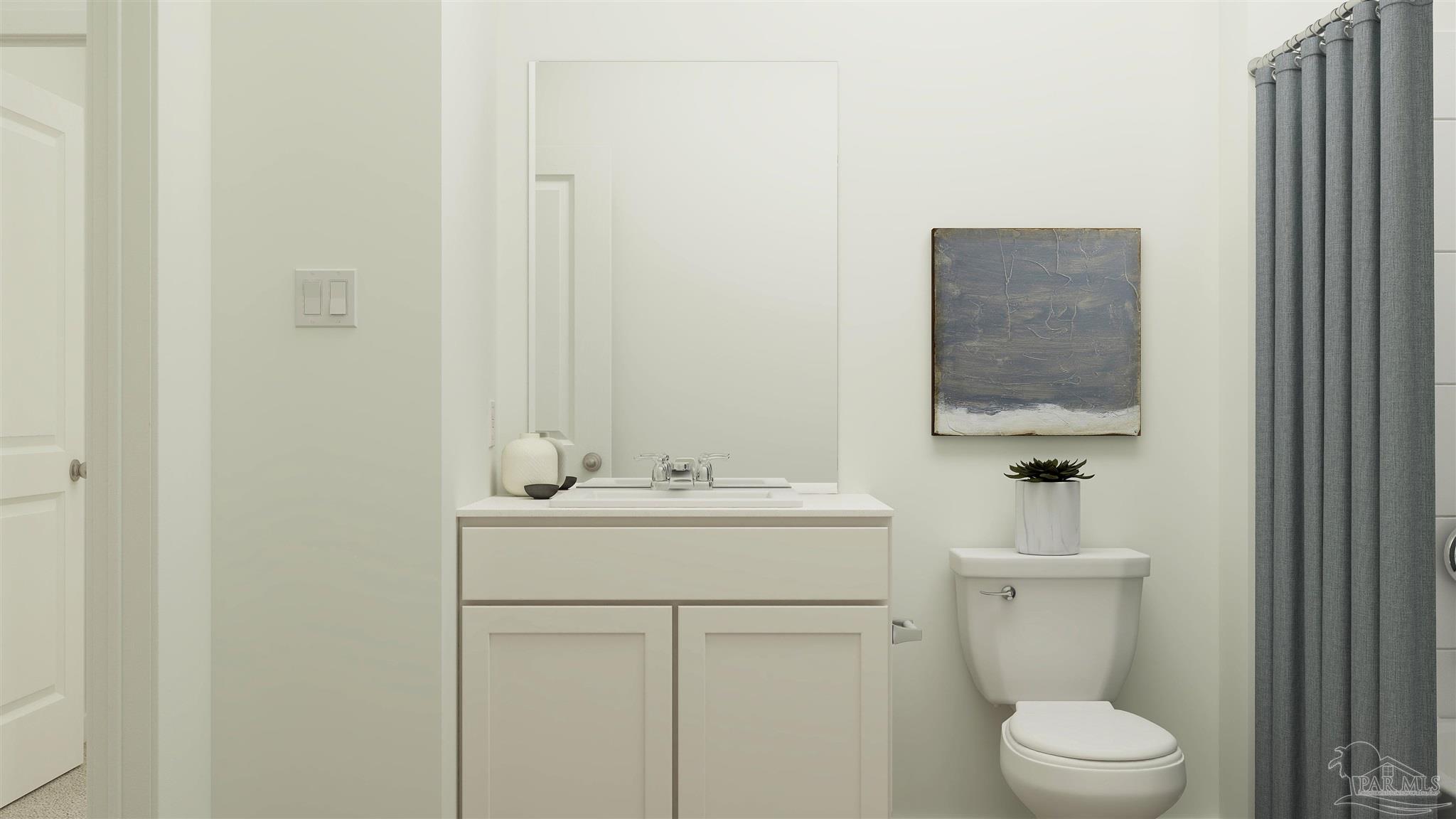 4770 Bald Eagle Road Pace, FL 32571 - Photo 17 of 21 a bathroom with a toilet sink vanity and mirror
