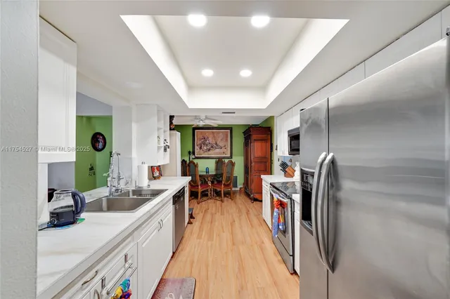 a view of a livingroom with workspace and a window