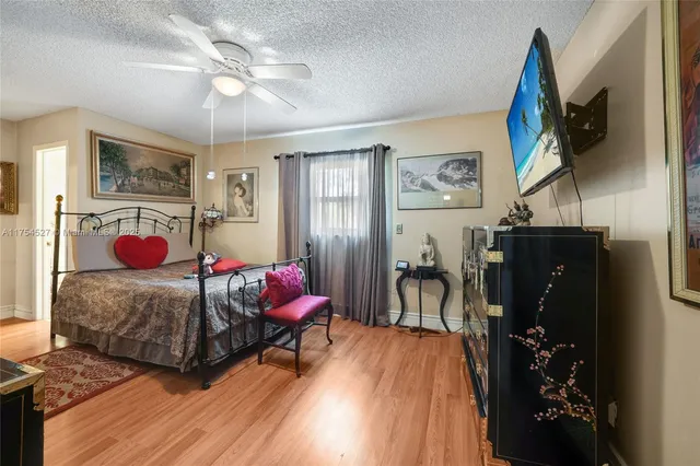 a bed room with a bed and a tv