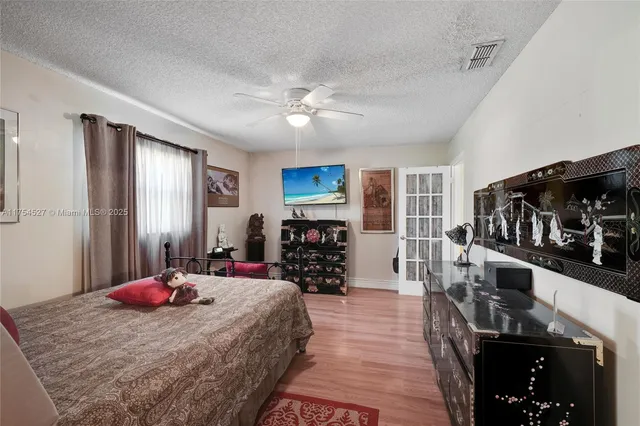 a bedroom with furniture and a window