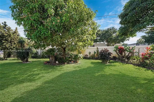 a view of a house with backyard porch and sitting area
