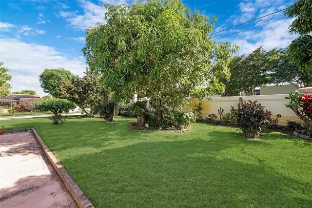 a view of a house with a garden