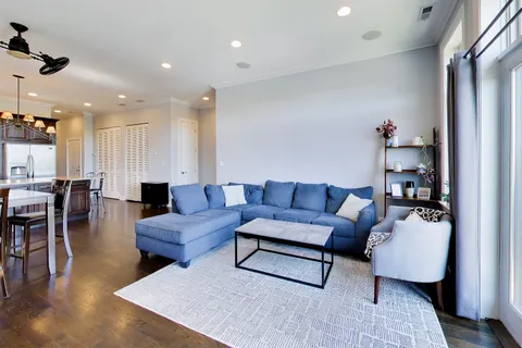 a living room with furniture fireplace and a flat screen tv