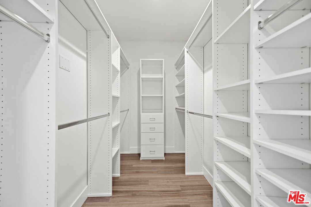 11847 Kiowa Avenue, Unit PH6 Los Angeles, CA 90049 - Photo 10 of 18 a view of walk in closet with empty racks
