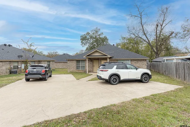 a view of a car in front of house