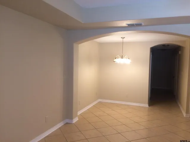 wooden floor in an empty room and a window