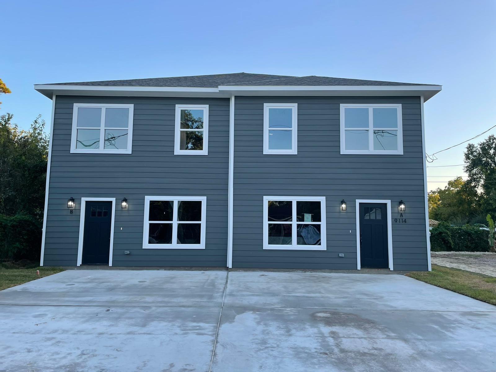 9114 Caddo Road, Unit A & B Houston, TX 77078 - Photo 1 of 24 Modern duplex exterior featuring horizontal siding in a dark gray finish