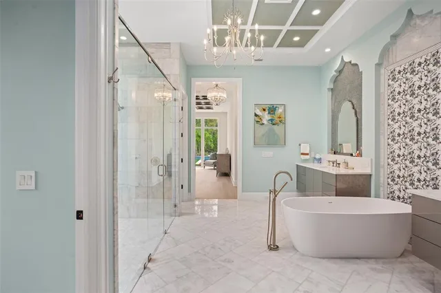 a large kitchen with kitchen island a sink stainless steel appliances and cabinets