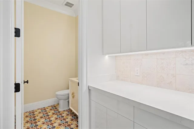 a spacious bedroom with a large bed and a large window