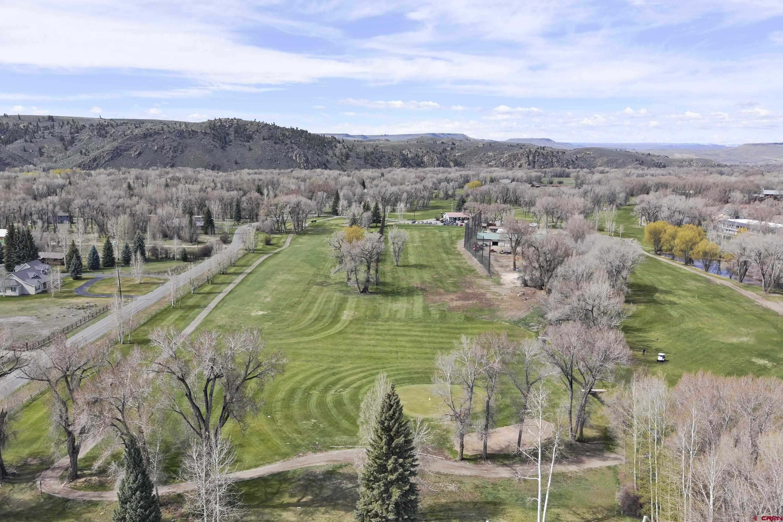 169 Camino Del Rio, Unit 8 Gunnison, CO 81230 - Photo 13 of 45 a view of a lake in middle of the town