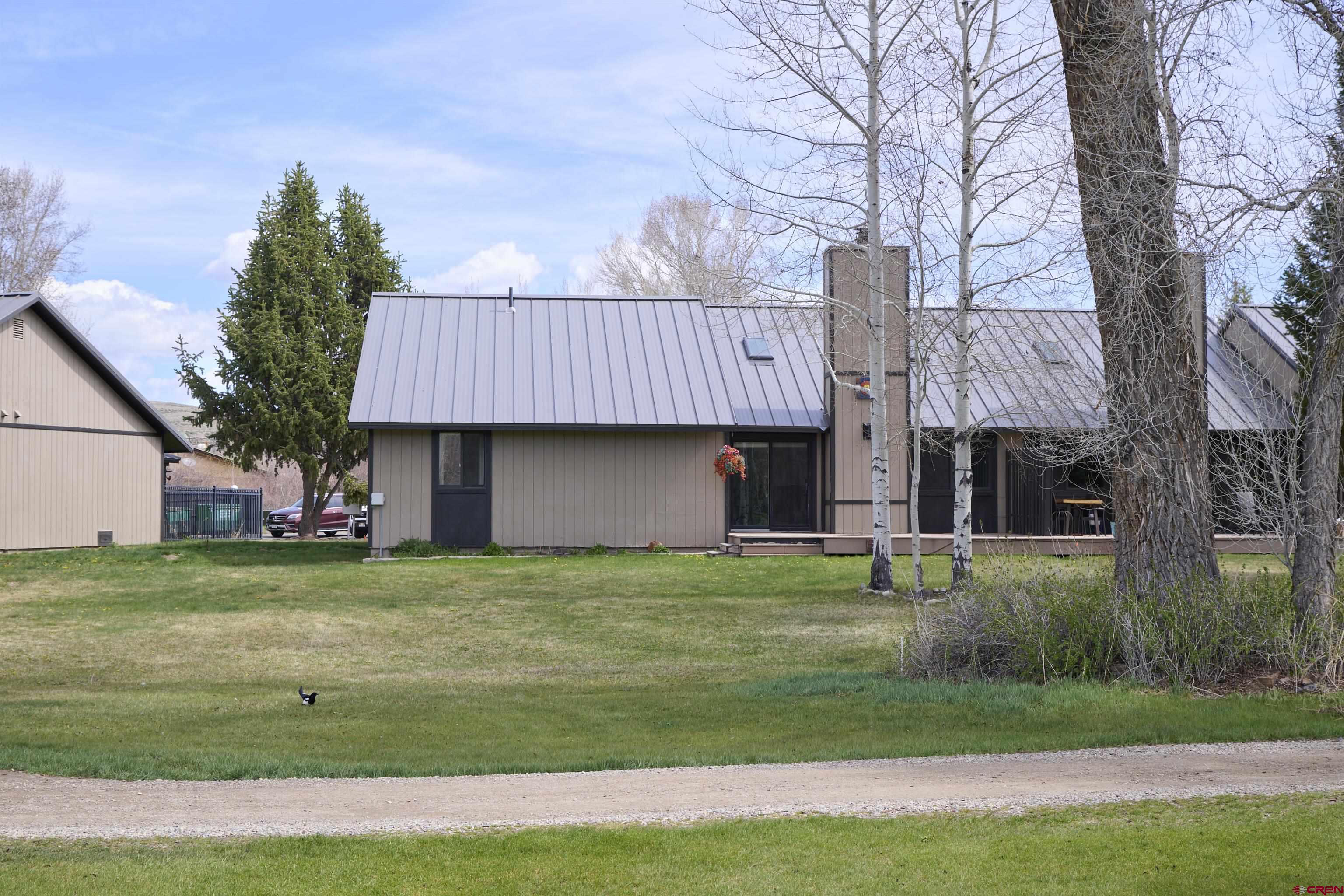 169 Camino Del Rio, Unit 8 Gunnison, CO 81230 - Photo 44 of 45 a house view with a garden space