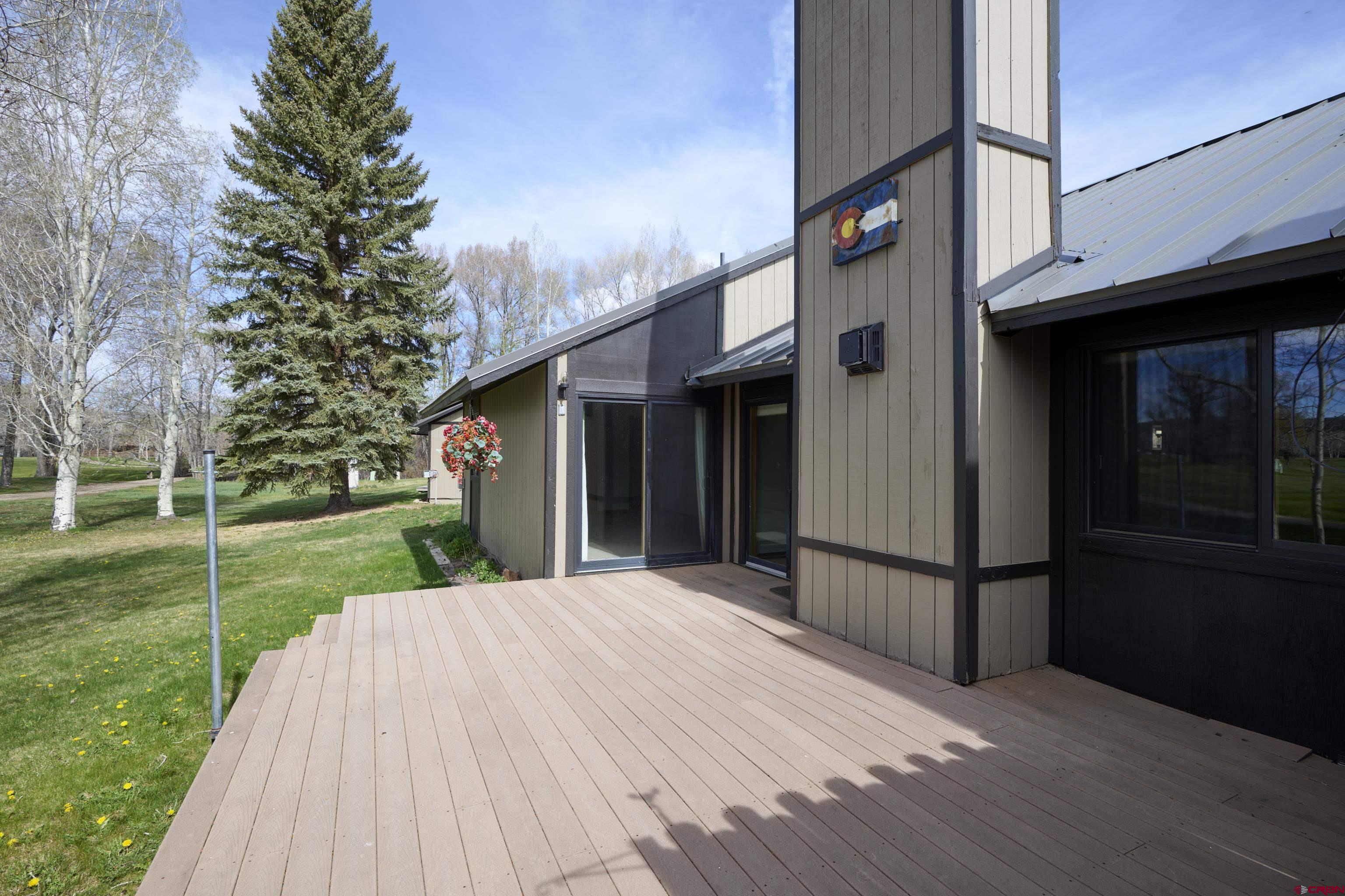 169 Camino Del Rio, Unit 8 Gunnison, CO 81230 - Photo 5 of 45 a view of a house with a yard