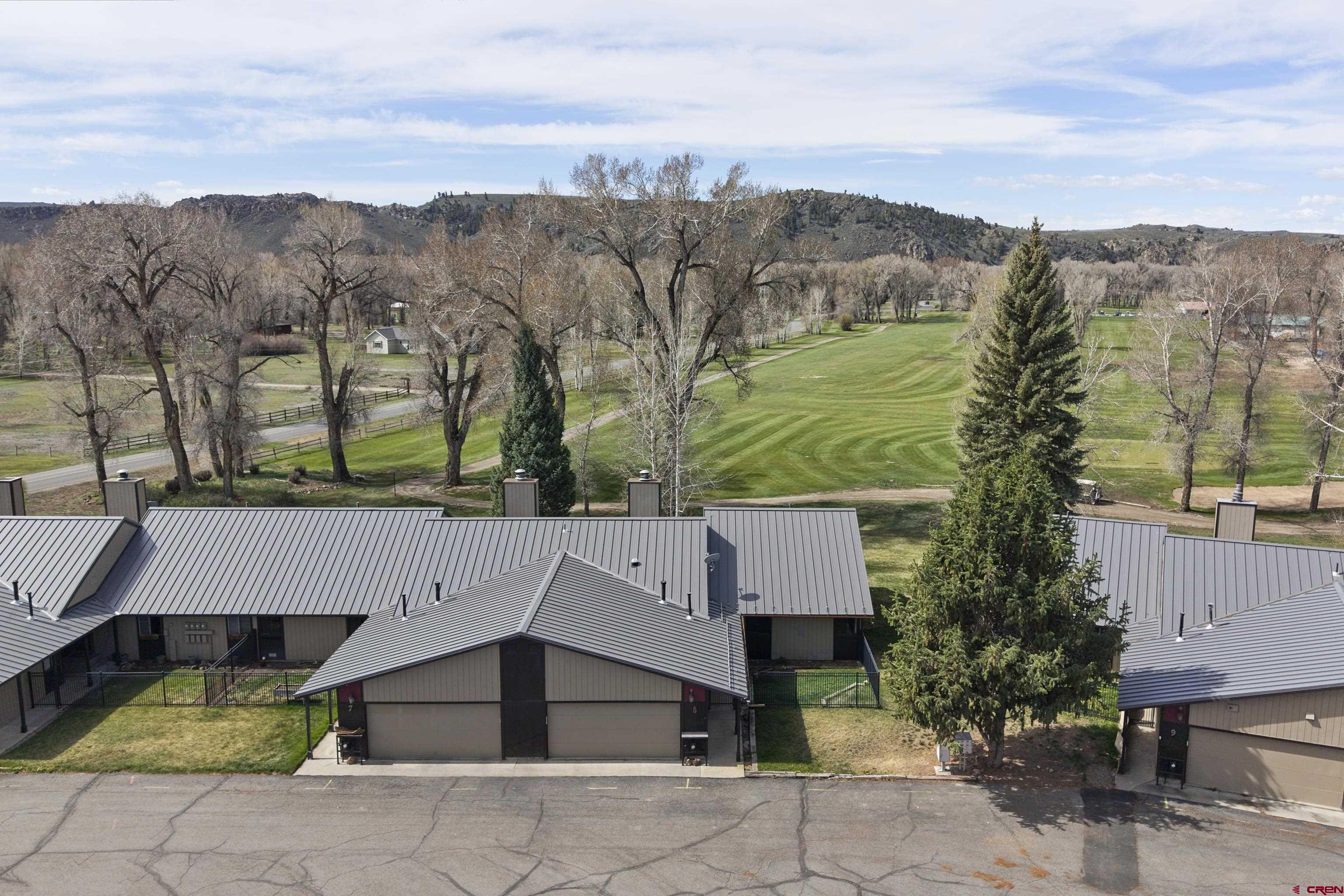 169 Camino Del Rio, Unit 8 Gunnison, CO 81230 - Photo 9 of 45 an aerial view of a house with a yard basket ball court and outdoor seating