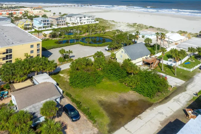 an aerial view of houses with trees