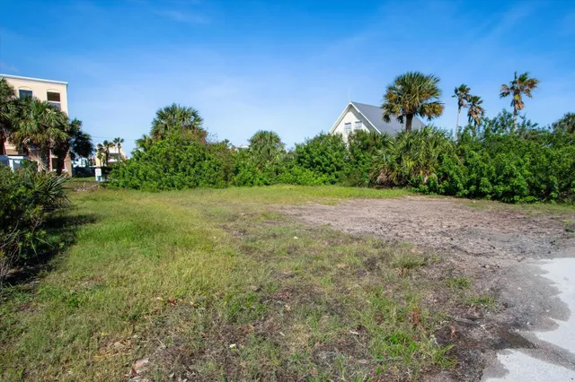 a aerial view of a house with a yard