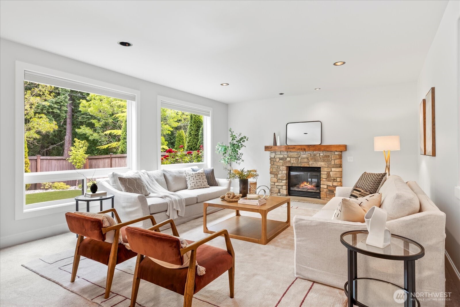 4426 219th Place Southeast Bothell, WA 98021 - Photo 6 of 40 a living room with furniture a fireplace and a large window
