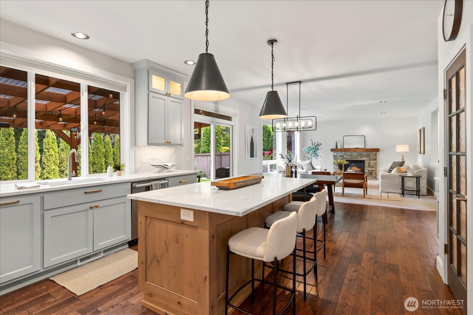 4426 219th Place Southeast Bothell, WA 98021 - Photo 7 of 40 a kitchen with stainless steel appliances a dining table chairs a sink and a window