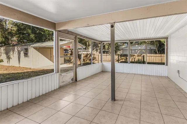 a view of an empty room with a balcony