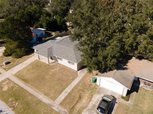 an aerial view of house with yard