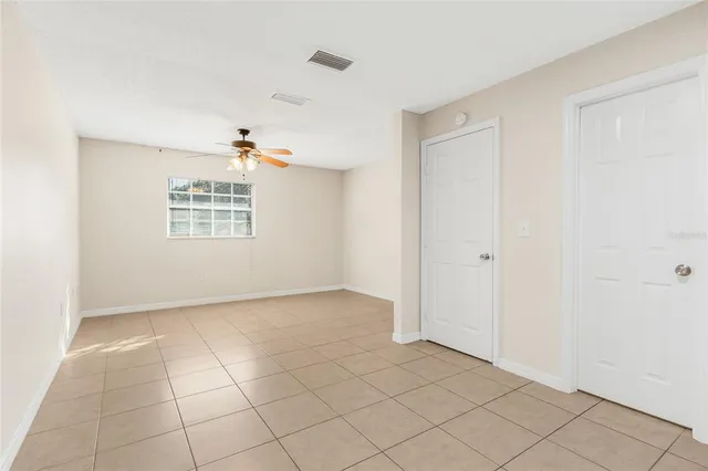 a view of an empty room with a window