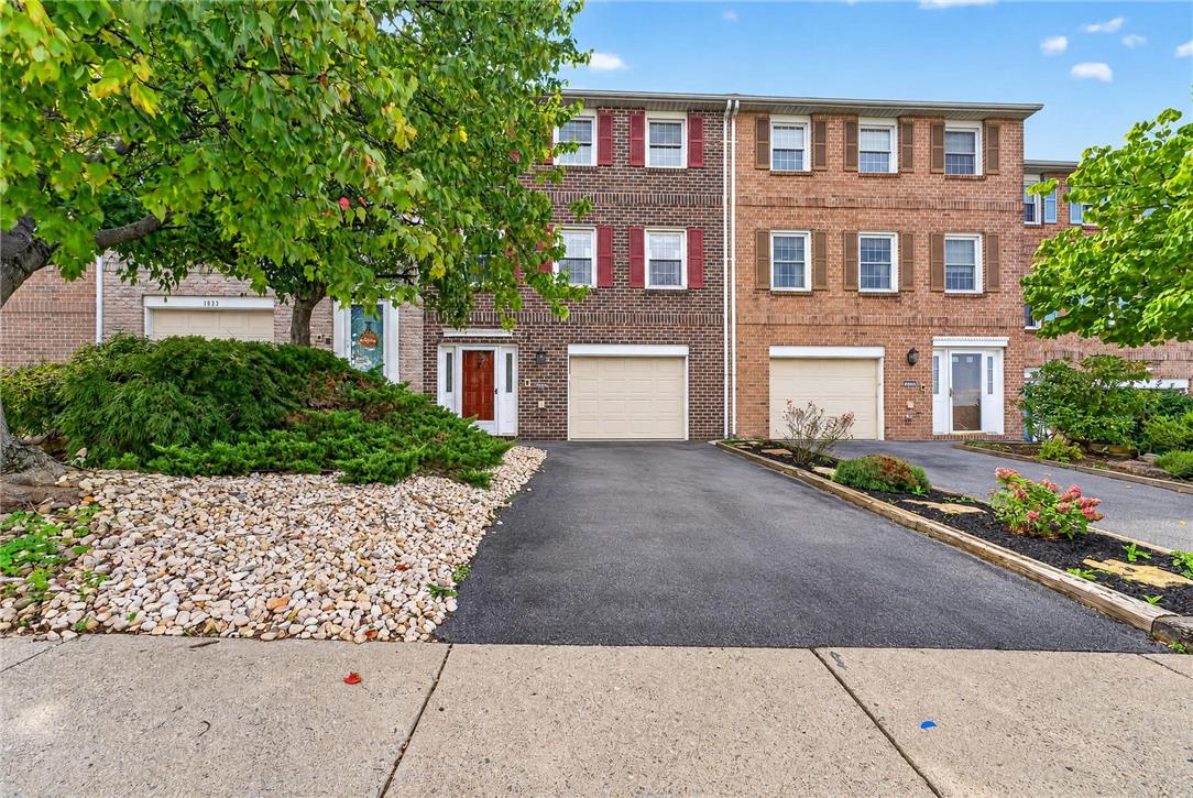 1097 Barnside Road Allentown, PA 18103 - Photo 1 of 22 Stately brick construction defines the exterior of this multi-level townhouse featuring a private paved driveway.