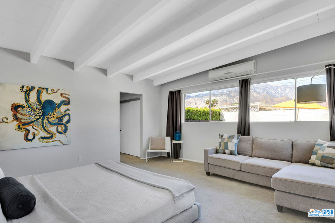 2267 North San Antonio Road Palm Springs, CA 92262 - Photo 29 of 60 a bedroom with a bed and a couch