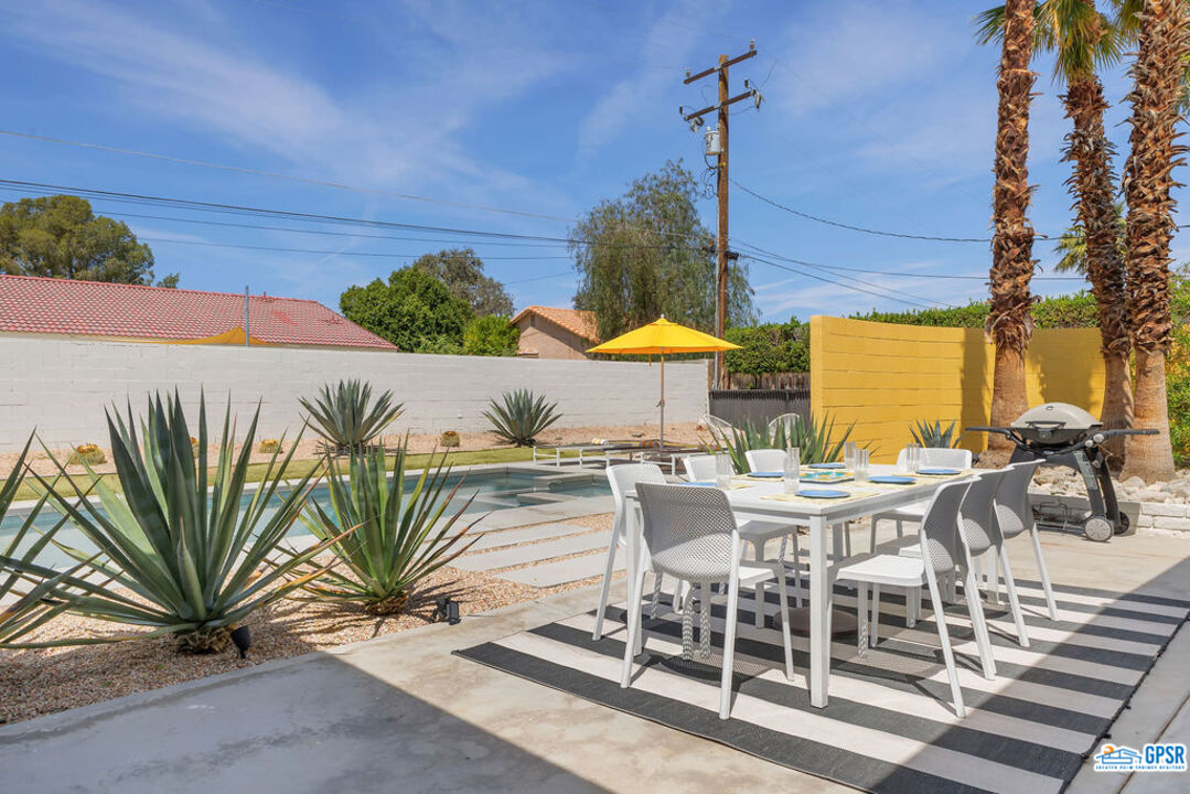 2267 North San Antonio Road Palm Springs, CA 92262 - Photo 42 of 60 a view of a swimming pool with chairs