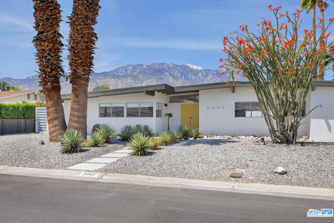 2267 North San Antonio Road Palm Springs, CA 92262 - Photo 56 of 60 a front view of a house with a yard and garage