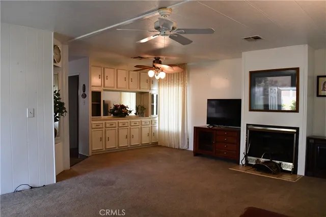 a living room with furniture and a windows