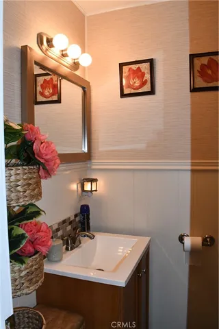 a kitchen with a sink and refrigerator