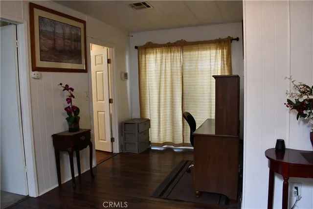 a kitchen with stainless steel appliances kitchen island granite countertop a stove and a refrigerator