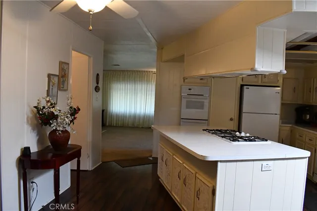 a kitchen with stainless steel appliances granite countertop a sink and cabinets