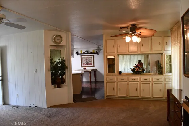 a kitchen with a sink appliances and cabinets