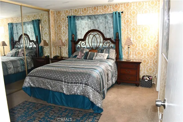 a spacious bathroom with a double vanity sink a mirror and a shower