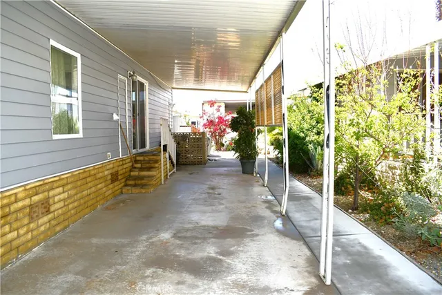 a view of a porch with wooden stairs