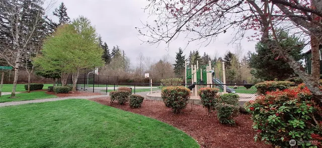 a view of a backyard with sitting area
