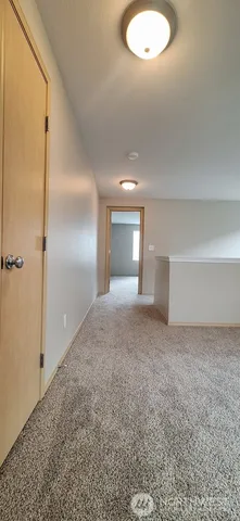 a view of a big room with windows and cabinet