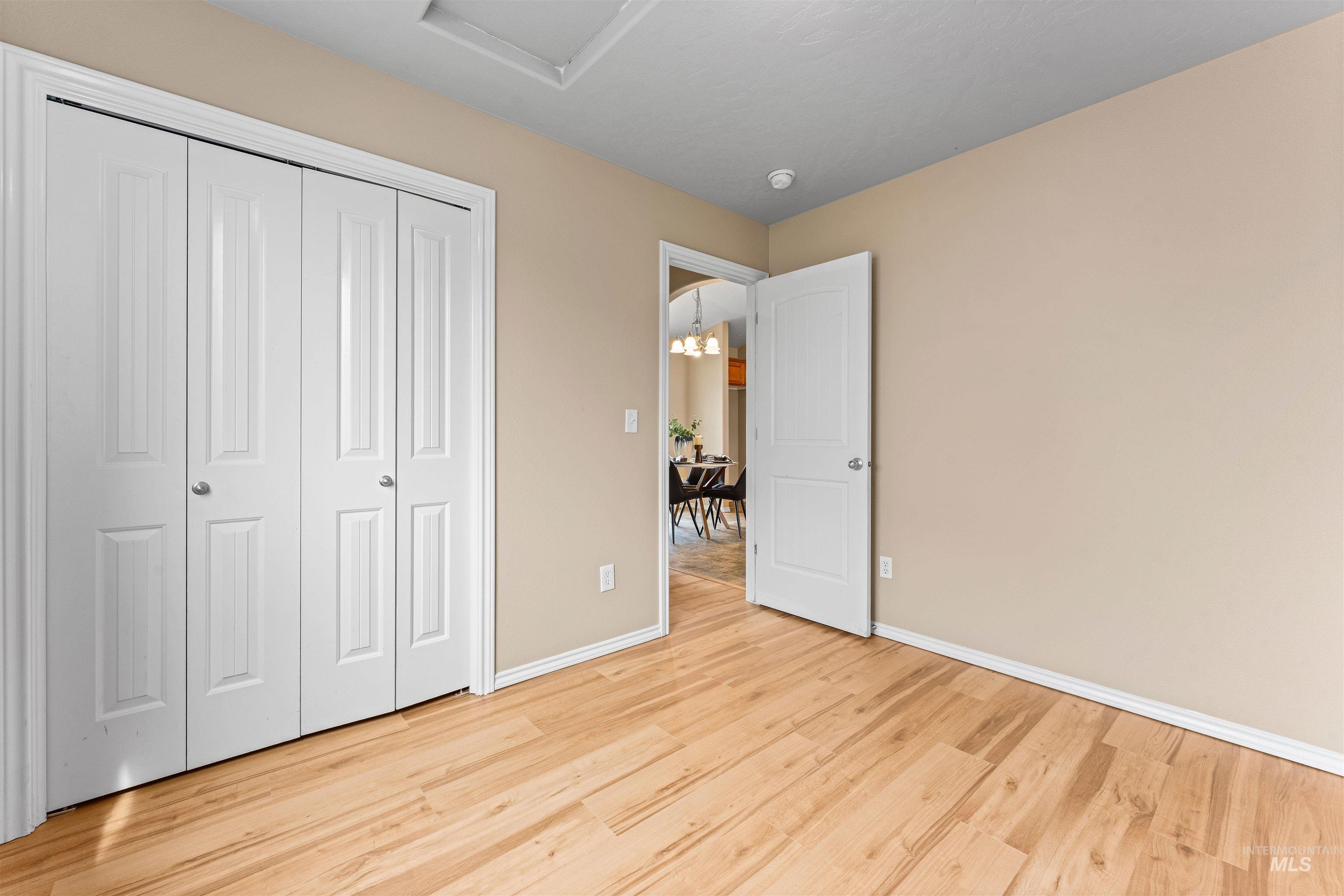 3923 Chatham Court Caldwell, ID 83607 - Photo 23 of 32 Unfurnished bedroom featuring a closet and light wood-type flooring