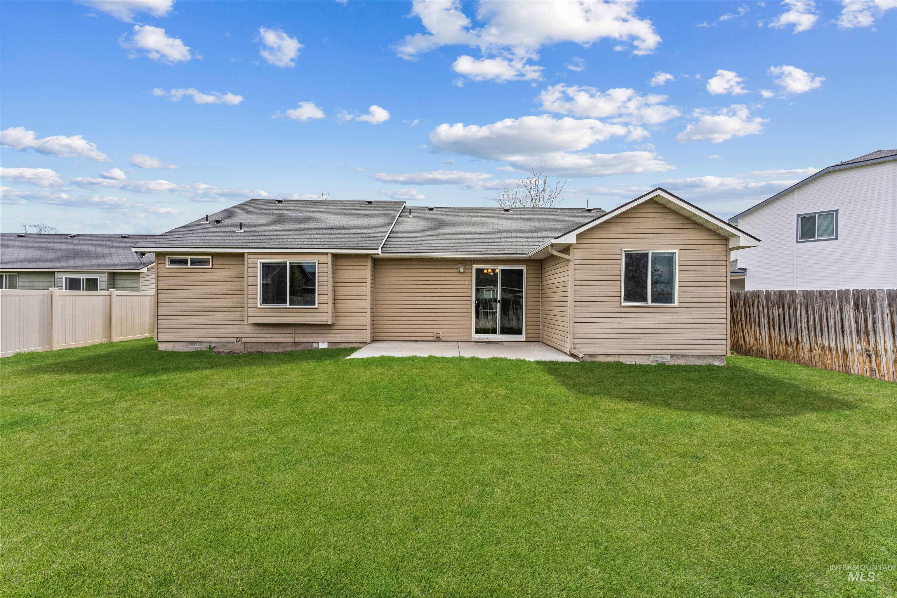 3923 Chatham Court Caldwell, ID 83607 - Photo 29 of 32 Back of house featuring a patio and a fenced backyard