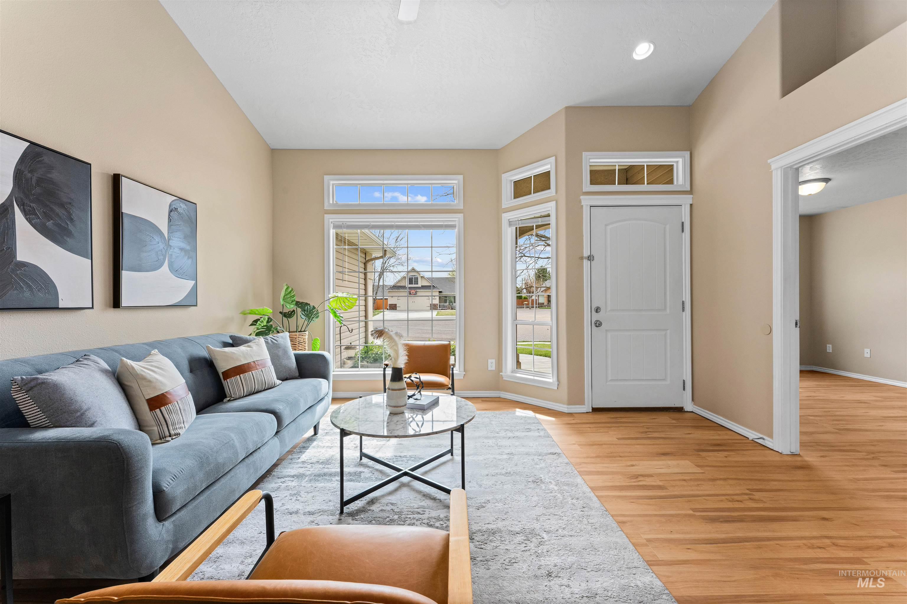 3923 Chatham Court Caldwell, ID 83607 - Photo 6 of 32 Living room with light wood finished floors and baseboards