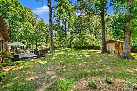 a backyard of a house with lots of green space