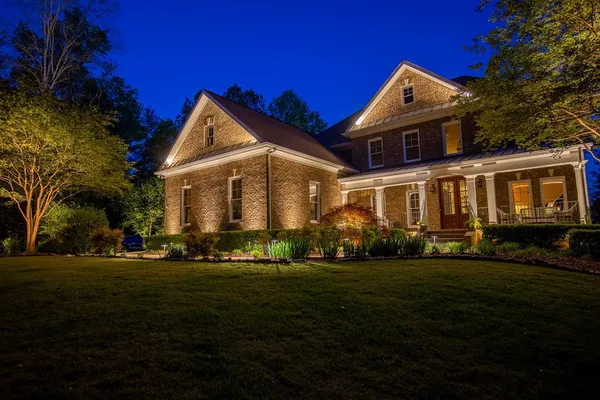 a front view of a house with a yard