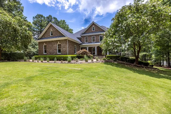 a front view of a house with a yard