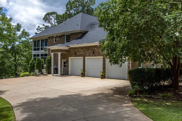 a view of a livingroom with furniture window and wooden floor