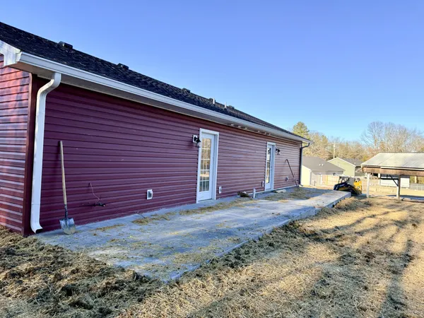 a view of a backyard of the house