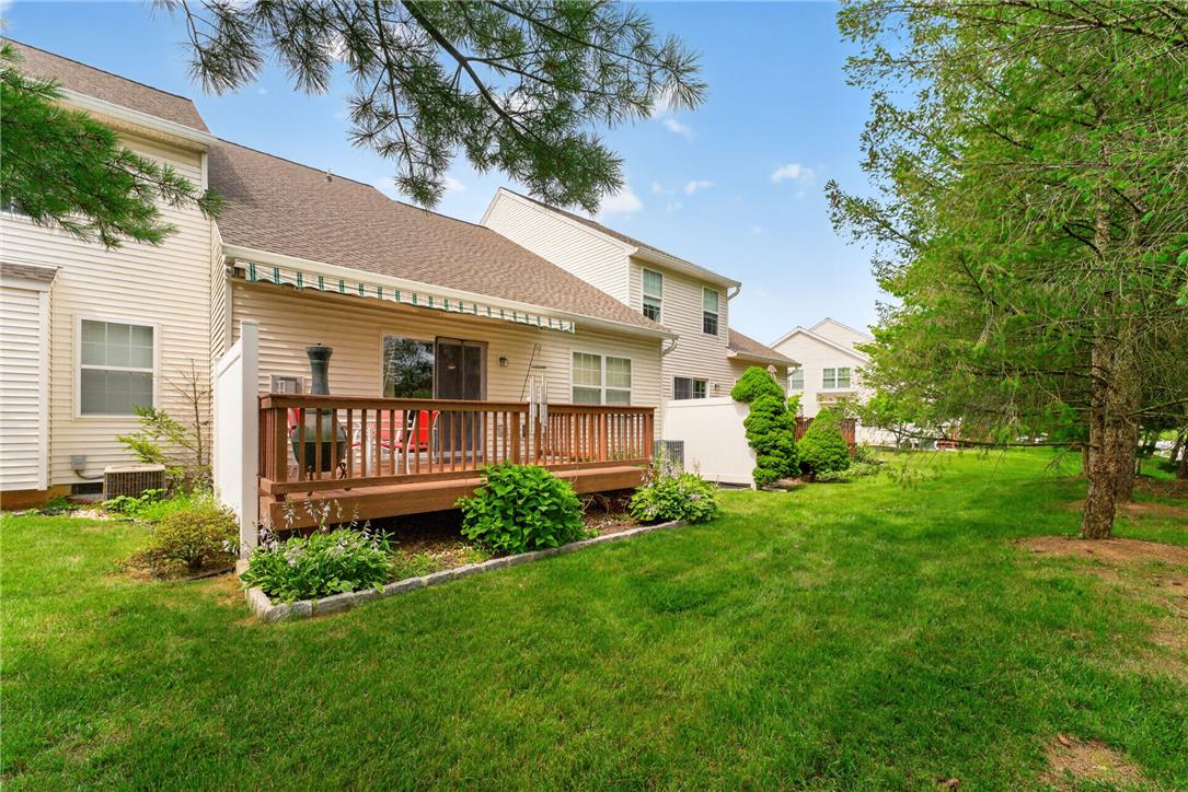 198 Park Ridge Drive Easton, PA 18040 - Photo 23 of 28 A spacious wooden deck extends from the rear of the residence, overlooking a well-maintained lawn.