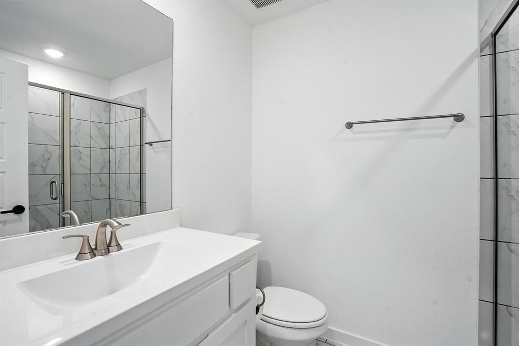4621 Mount Vista Road Oak Point, TX 75068 - Photo 29 of 40 a bathroom with a sink toilet and shower