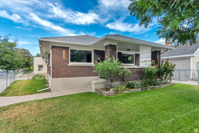 4883 South Center Street Murray, UT 84107 - Photo 28 of 32 Brick and stucco exterior with a covered front porch featuring square columns