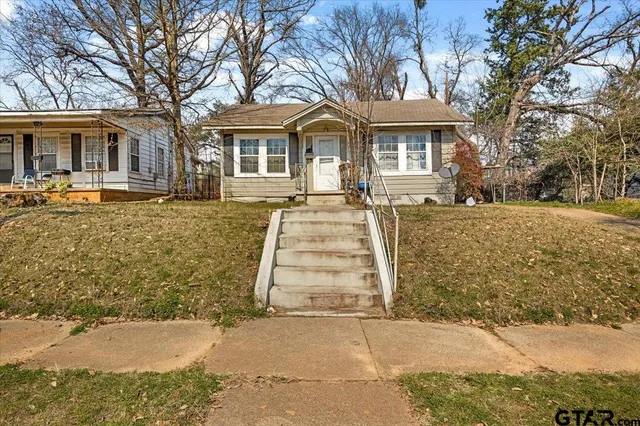 front view of a house with a yard